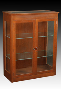 200 series showcases #242-17, Showcase, 42"H x 36"W x 16¾"D. Two adjustable glass shelves and glass top inlay. Hinged glass door.