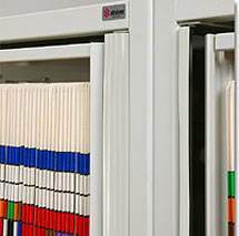 Plastic safety strips on the edge of the cabinet prevent fingers from being pinched