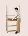 2. Lay a shelf over the bottom shelf supports. Then, moving upward, continue to add supports and shelves at each level.